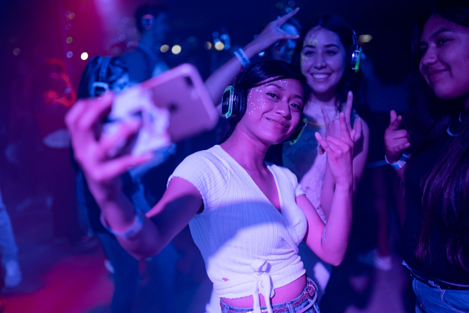 Friends capturing a nightlife moment together