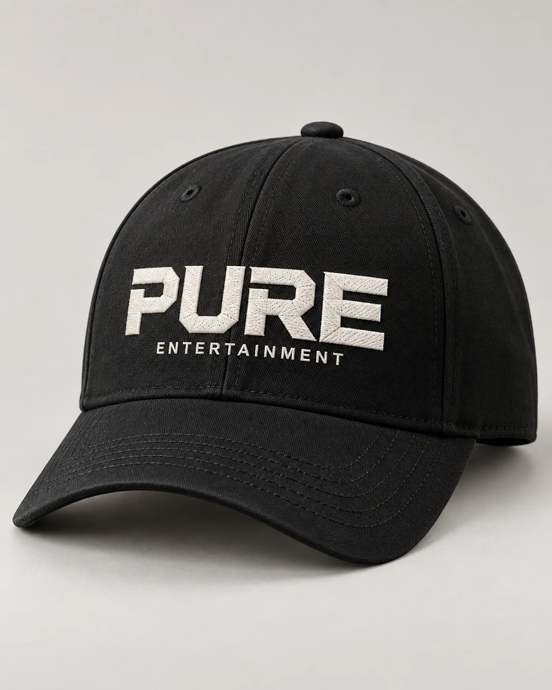Black PURE Entertainment cap design mockup with white embroidered wordmark